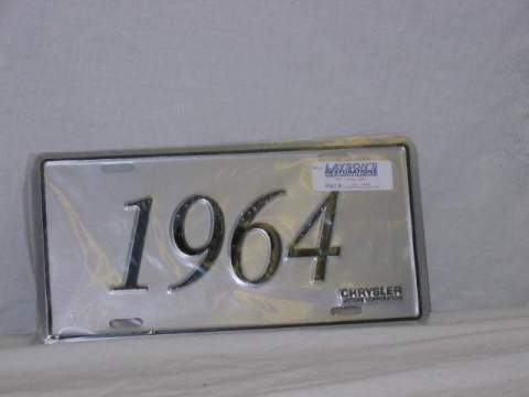 License Plate Silver plate, shows the year (1964) of the car in black script.