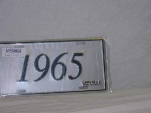 Silver plate with "1965" in black script