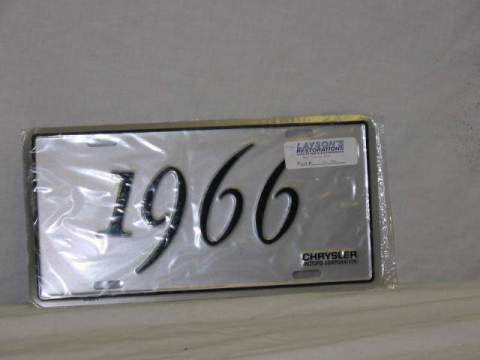 License Plate Silver plate, shows the year (1966) of the car in black script.