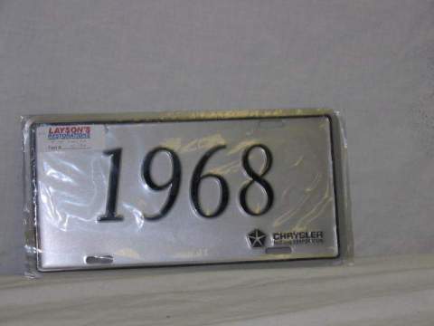 License Plate Silver plate, shows the year (1968) of the car in black script.