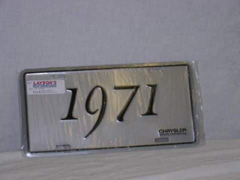 License Plate Silver plate, shows the year (1971) of the car in black script.