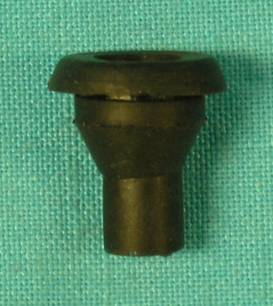 License light wire grommet.  Round plug that goes into the sheetmetal where the wire for the license plate wire passes through into the truck of the car....