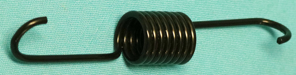 Black Trunk Bumper Jack Storage Spring. Reproduction spring secures the jack mechanism in the storage position and also has the correct plating.