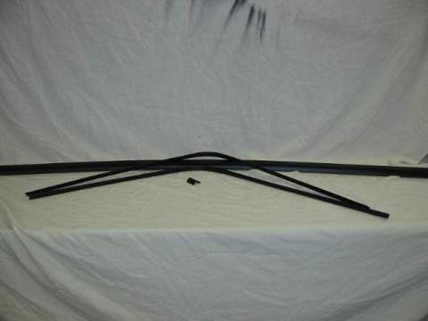 INTERIOR REAR WINDOW TRIM 4 piece set.  Includes the lower section.  This is the two curved side pieces that meet at the top center, one top center piece, and one lower piece.