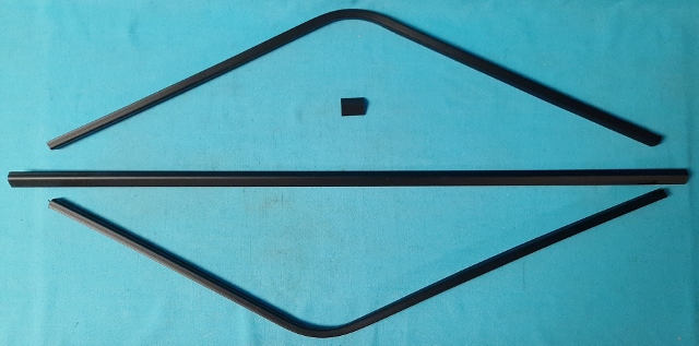 Interior Rear window mldg - 4 piece set.  Does not include lower corners.  Two curved side pieces that meet at the top center, one center piece and one bottom piece.