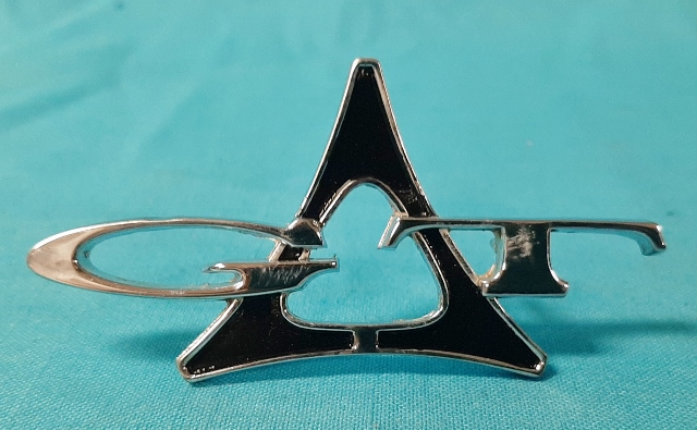 "GT" emblem (1963 Fender emblem and for 1964 its on the C-pillar) - Original part #2255 116