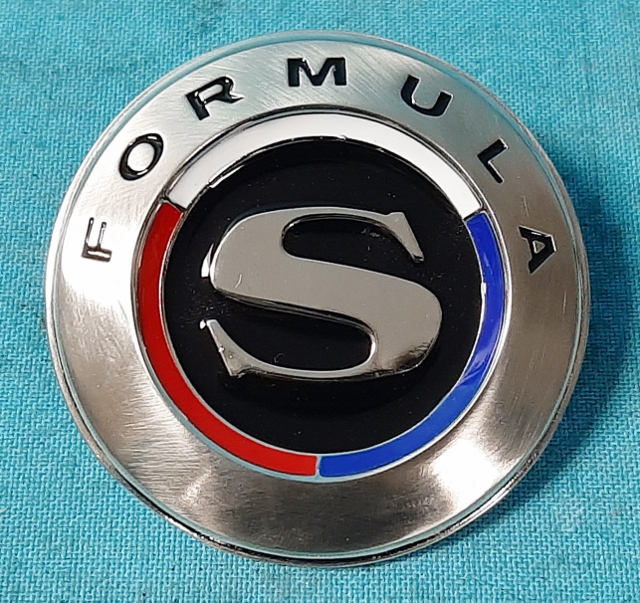 Formula "S" Reproduction Fender Emblem.  Original part number was # 2579 442.  Tabs are in horizontal position when installing.
