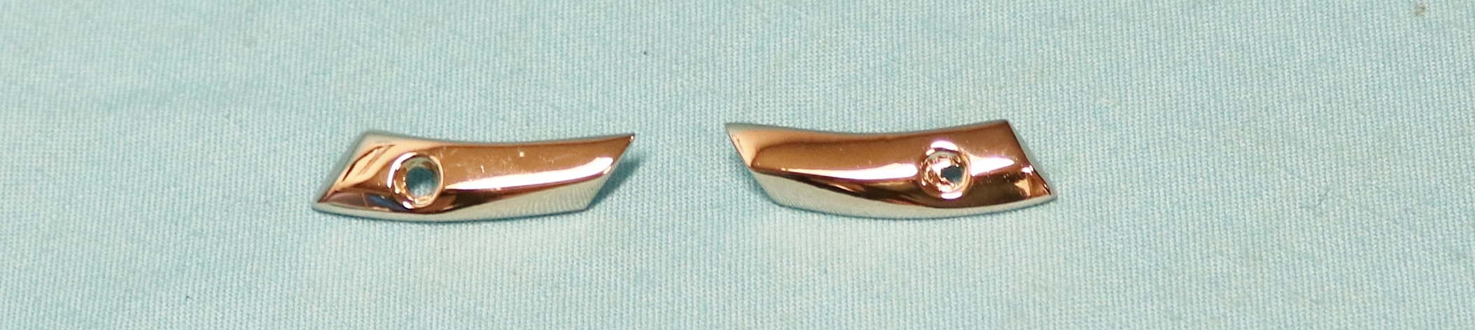 Vinyl Top Chrome A-Pillar Stops.  These are located at the front of the vinyl top at the A-pillars and separate the vinyl top ends from the painted surface (held in with One screw) – screw not included.    (pair)
