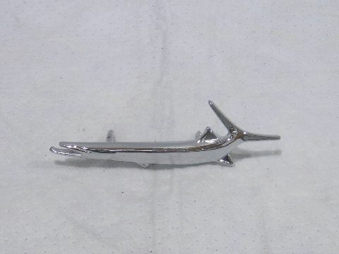 Fender "fish" Drivers side fender emblem - reproduction.  Original part was #2963 657.  Pins are 1-3/8" apart from each other.