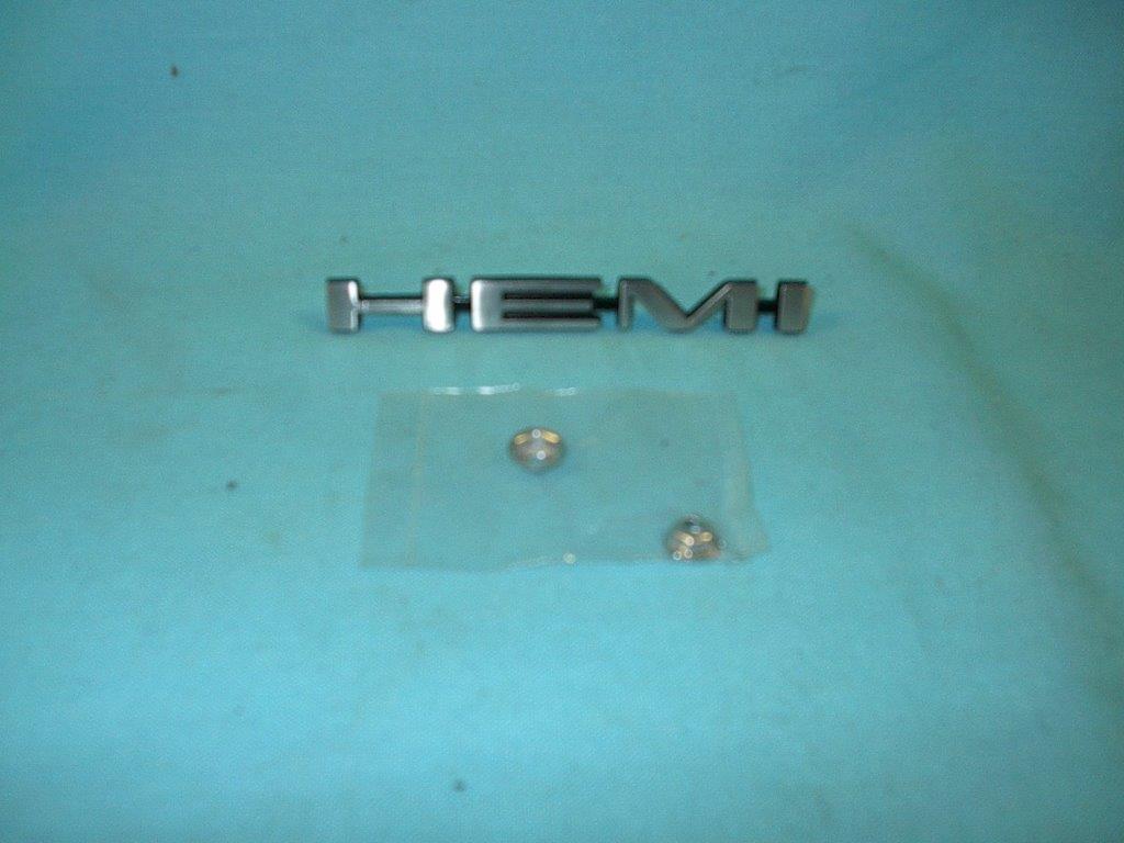 "Hemi" Hood scoop nameplate. Attaches to the hood scoops as an Air Grabber hood emblem. Use 2 per car