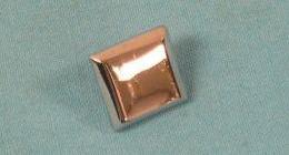 <b>Map Pocket Trim Button</b>. This square button-like piece attaches to the corners of the map pockets. It has the correct beveled edges with brushed finish and mounting spike.