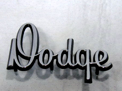 "Dodge" script emblem on hood/trunk lid. #2786 482. Not correct for GT models, 1970 Dart Hood - not correct for 1970 Dart trunk lid - see part #399-62475 .