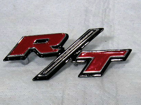 Charger R/T headlight door emblem.  Requires 2 machine screws for install.  Use with MR-VC121.