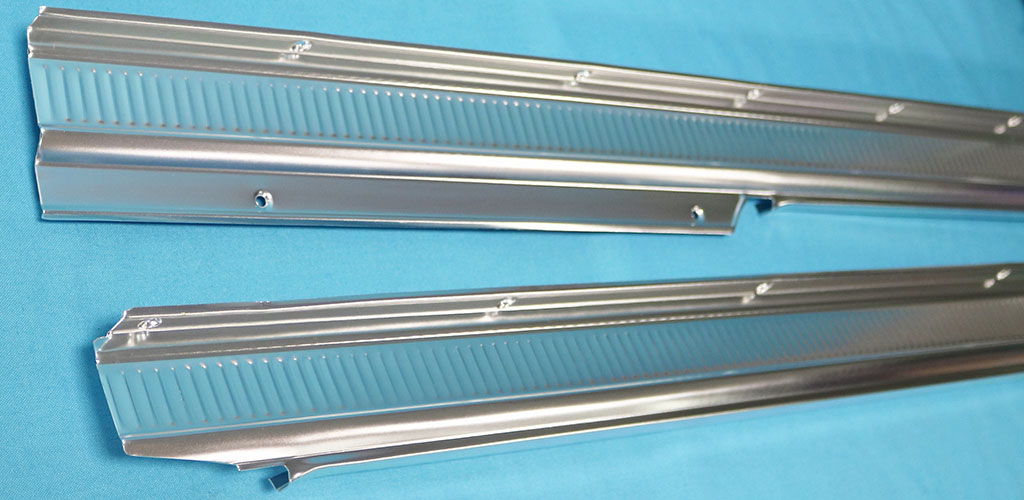 Aluminum carpet hold downs; Pair.   Fits also the 1961-62 Lancer and Valiant with some trimming required.