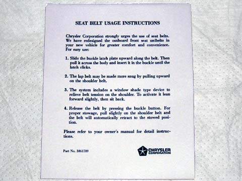 Seat belt sun visor instruction sleeve