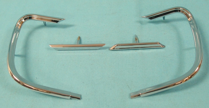 Complete Set (4) Tailpanel Moldings.  These are pot-metal reproductions and include the large "C" pieces found normally to be pitted or broken.