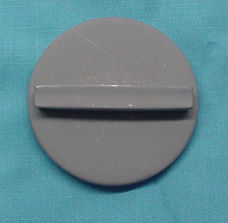 Stock fuel cap with the straight bar handle, grey primer.