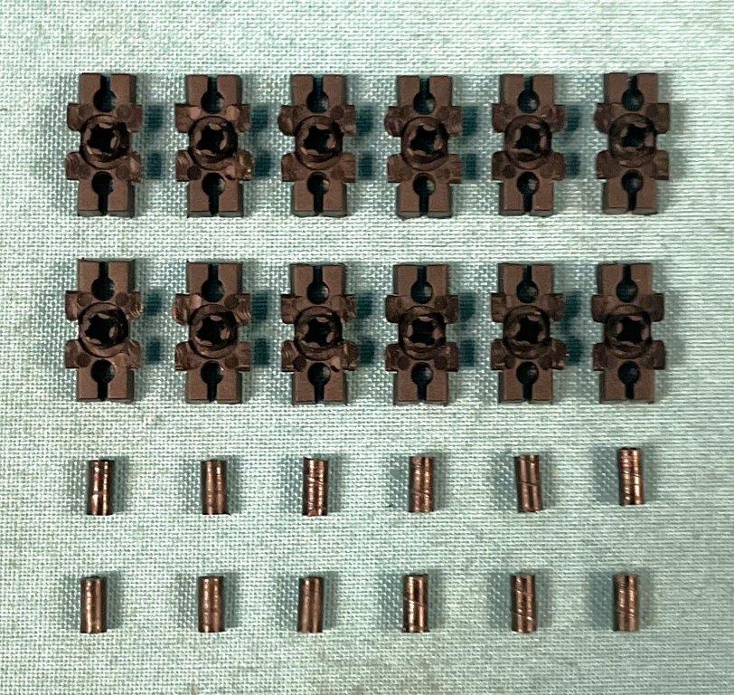 Reproduction tail panel molding clips. This set of 12 Black plastic clips and plugs which are used to attach the #IN-J51 moldings to the tail panel. Use 1 set per car.