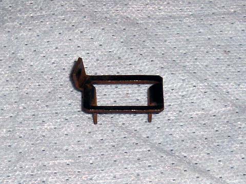 - Exhaust Manifold Bolt Retainer: 4 are required per car (1 per bolt) New Chrysler small-block exhaust pipe-to-manifold bolt retainer.  This retainer is mounted between the bolt and exhaust flange.  When the bolt is fully tightened the tab folds over to prevent the bolt from loosening.  These retainers were used on cars starting after Dec 2nd, 1968 (1969 model year) to 1974 on small blocks only.