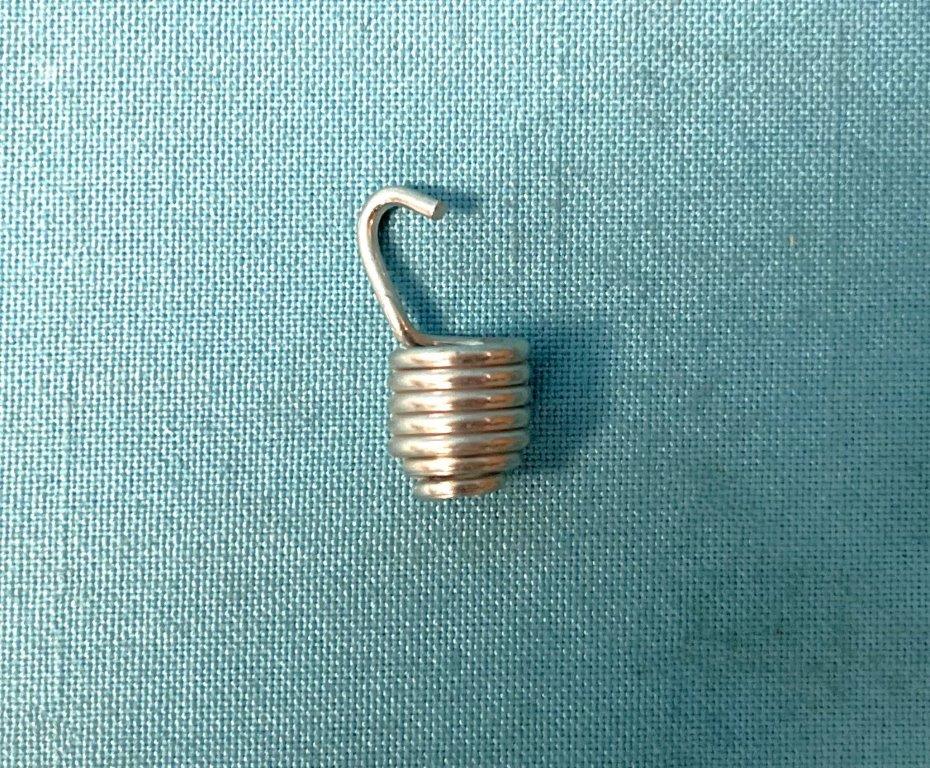 Headlight adjuster spring.  Reproduciton hardware fits all years and models. Use as required.