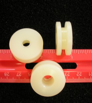 Quarter Window Roller Guide - White - Small Hole - 1-1/16" diameter roller guide with 3/16"  diameter hole,  5/16" wide with 3/16" between shoulders.
- Component of Quarter Window Roller Kit