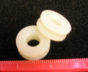 Quarter Window Roller Guide - White - Large Hole - 1-1/16" diameter with 3/8" diameter center hole 
- Component of Quarter Window Roller Kit