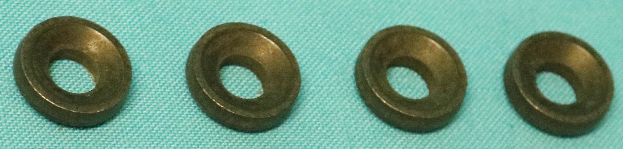 Stud Washers - Exhaust Manifold Stud Washer: Exhaust manifold stud washer for 1967-and-later 273, 318, 340, and 360 engines.  This is the special cone-shaped washer used on the front and rear exhaust manifold-to-cylinder head stud.  New Chrysler part.  Sold as a package of 4.  Use one package per car.