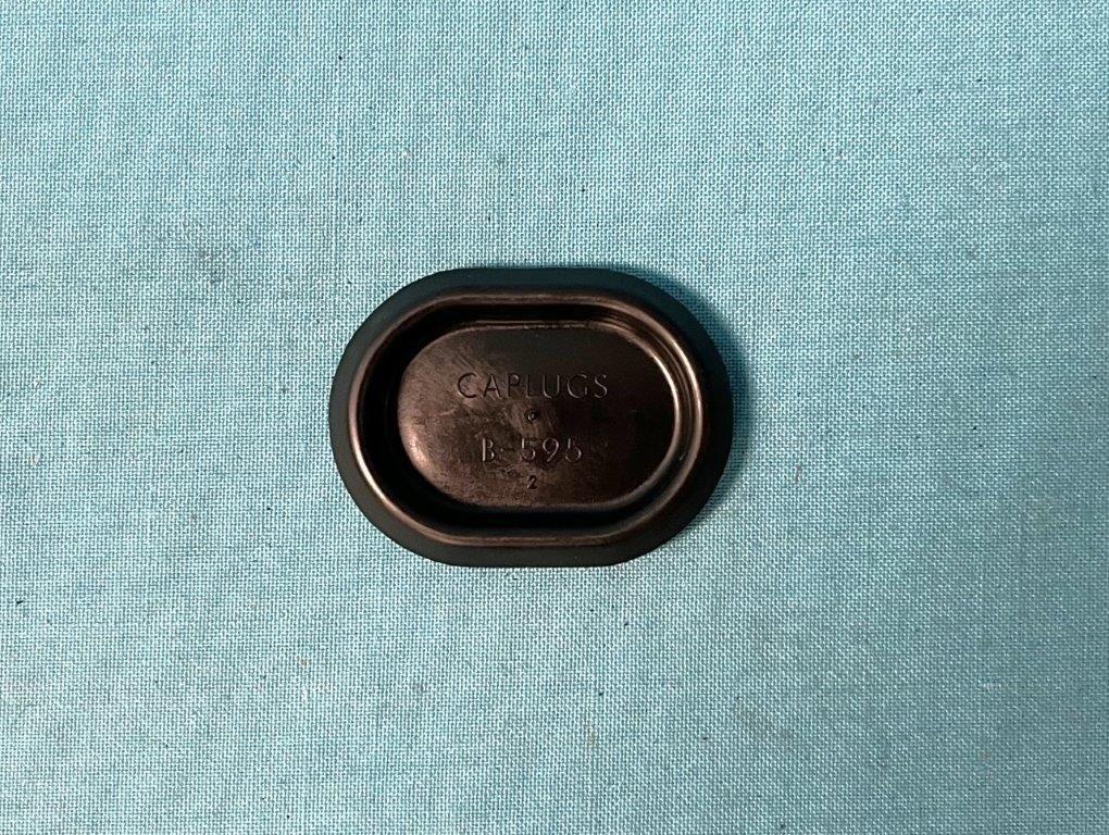 Firewall Plug. New Chrysler firewall plug for all automatic transmission models. This plastic oval-shaped plug is designed to cover the hole in the firewall intended for the clutch linkage.