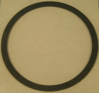 Gasket.  New Chrysler large circular gasket between the block and adapter on small block engines.