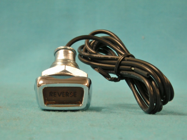 Dash mounted Reverse Light. Reproduction of the 4-speed dash mounted reverse light assembly. This is the chrome assembly with lens and the wiring pigtail.  Has the “Reverse” in black over the yellow lens.  Used only for 3 & 4-speed floor shift vehicles.  Discount exempt