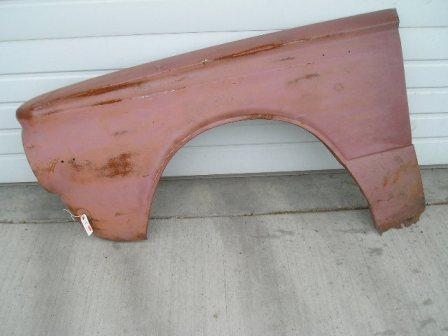 Drivers side Front Fender.  Has dogleg area bent backwards From storage and at bottom of doglet some rust holes and rust.  For this price fender is as is.  For additional $50 we will sell you along with this fender our NEW dogleg patch panel to go with fender - normally $89 retail.