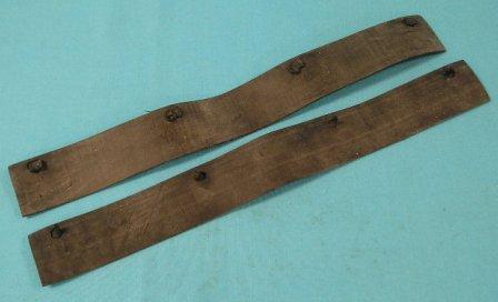 Set of two die cut rubber vent seals with correct sealing wire clips.  One used on each side of the Air Grabber/Ramcharger plenum to allow water & other foreign material to exit, while keeping the hot engine compartment air out. Often missing or painted over.   This version found on early 1969 model cars.  Plenum for this style has 3 larger rectangle openings on each side.