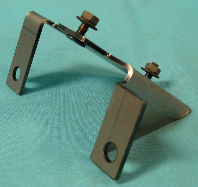 Coil Bracket - Reproduction - 1969-71  440 6-bbl coil mounting bracket.  Stamped-steel bracket that provides an attaching point for the coil mounting 
strap MN-MS180.  The bracket uses intake manifold bolts (not included) to fasten to the manifold.  Does not come with nuts to attach strap.  Bare metal ready for paint or power coating.