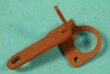 Throttle Return Spring Brackets383 without A/C and 440 without A/C engines with 4-bbl.  The P.C.V hose on these cars passed through the large hole in the bracket. Painted Orange...