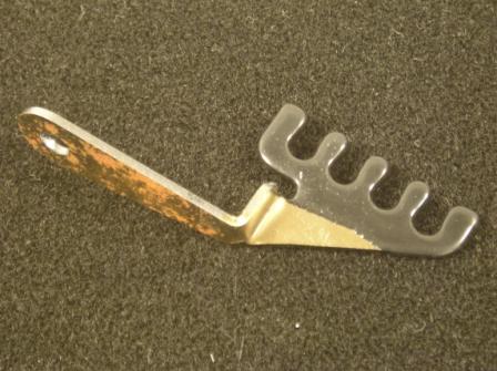 426 Hemi Center Wire Separator bracket.  Used on all round  air cleaner equipped cars including 1970 Charger.  Bolts to upper coil bracket bolt and faces forward.  Bracket does NOT get painted with engine since it is bolted in place with the coilbracket at time of assembly. (1 per car needed)