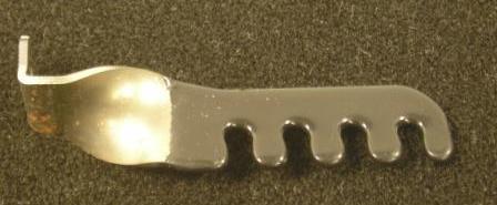 426 Hemi Drivers side wire separator bracket.   Used on all round air cleaner equipped cars including 1970 Charger. Bolts to front throttle return spring bracket bolt and faces forward.  Painted with engine assembly.   (1 per car needed)