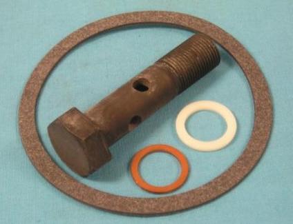 Small-Block Oil Filter Adapter - Attaching bolt & Gasket Package.  This new bolt passes through the center of the adapter and secures it to the block. This bolt is stronger than the original for better sealing.  Also includes the 90 degree circular seal between the block and the adapter - Discount exempt